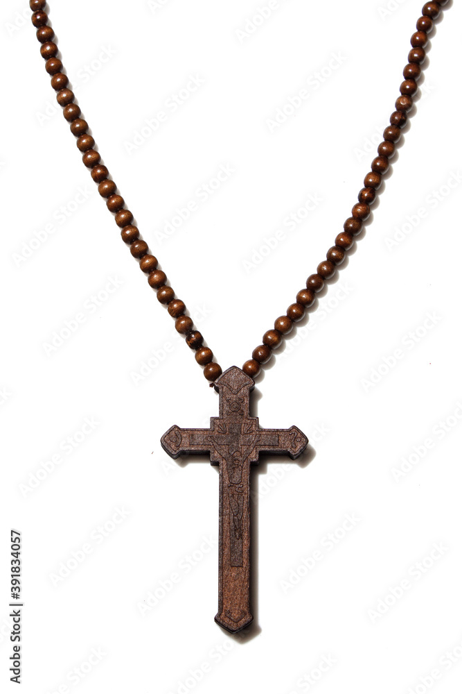 Wooden christian cross necklace isolation on white background Wooden christian cross necklace isolation on white background