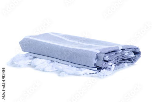 Folded gray beach towel on white background isolation