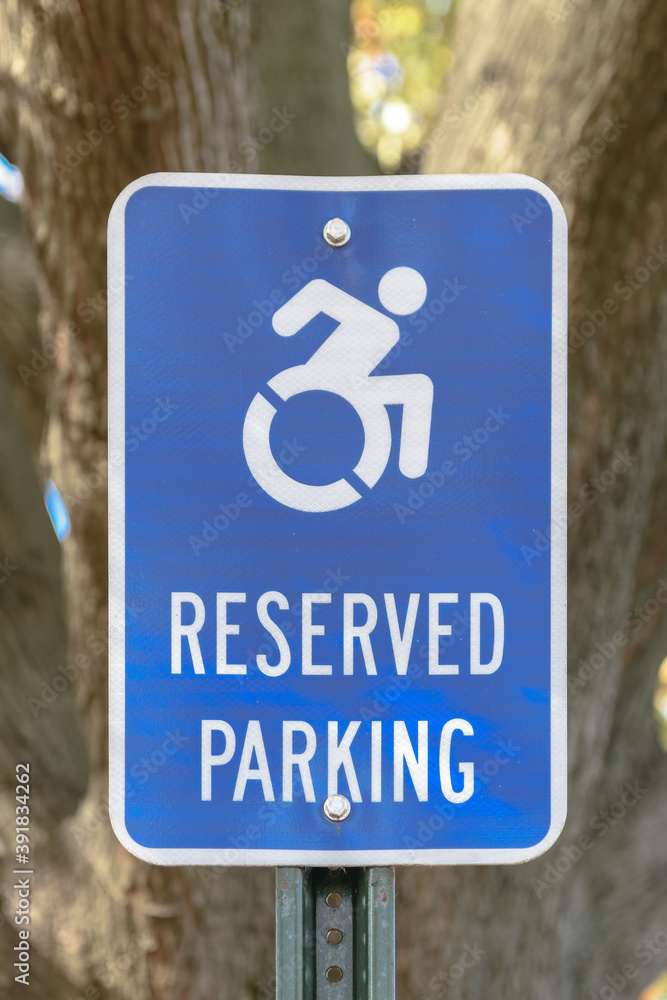 Reserved Parking with illustration of moving wheelchair Reserved Parking with illustration of moving wheelchair