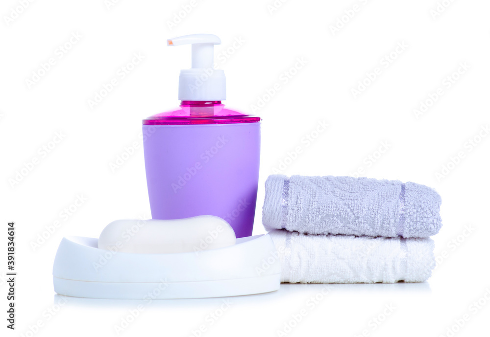 Stack hand towels with white soap dish, and soap with dispenser on white background isolation Stack hand towels with white soap dish, and soap with dispenser on white background isolation