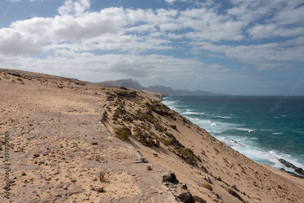 Dunes and cliffs by the Atlanctic Ocean. Barlovento beach, Fuerteventura, Canary Islands. 