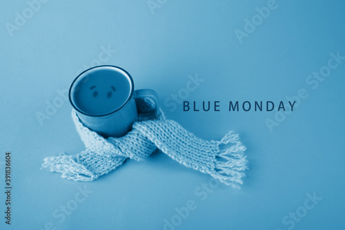 Photos Blue cup with scarfcoffee on blue background. Blue monday concept