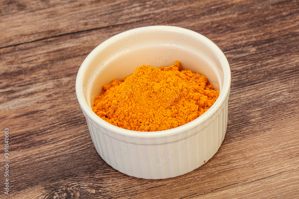 Tumeric powder in the bowl Tumeric powder in the bowl