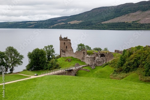 Ruins of stone Urquhart Castle on a bank of Loch Ness in the Scotland