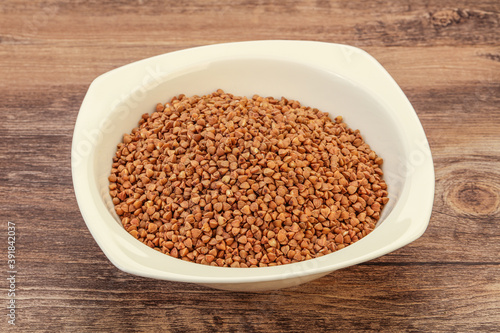 Fototapeta Naklejka Na Ścianę i Meble -  Raw buсkwheat cereal in the bowl