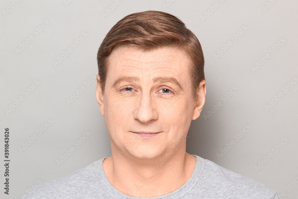 Portrait of blond mature man with happy expression and smiling Portrait of blond mature man with happy expression and smiling