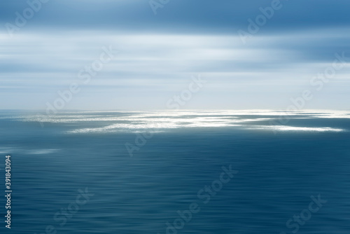 Creative artistic photo of the sea, blurry surface, blurry motion. Sea and sky. Blurry effect, postcard. Motivation. Journey concept. Peacefull sea or ocean © renatados