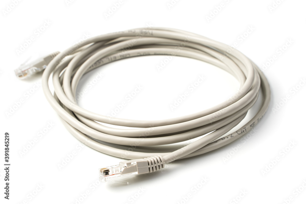 The cable for connecting the computer and router is isolated on a white background. Patch cord. Side view. The cable for connecting the computer and router is isolated on a white background. Patch cord. Side view.