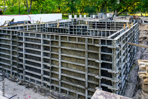 construction of new building foundations using precast system formwork for concrete pouring © Zigmunds