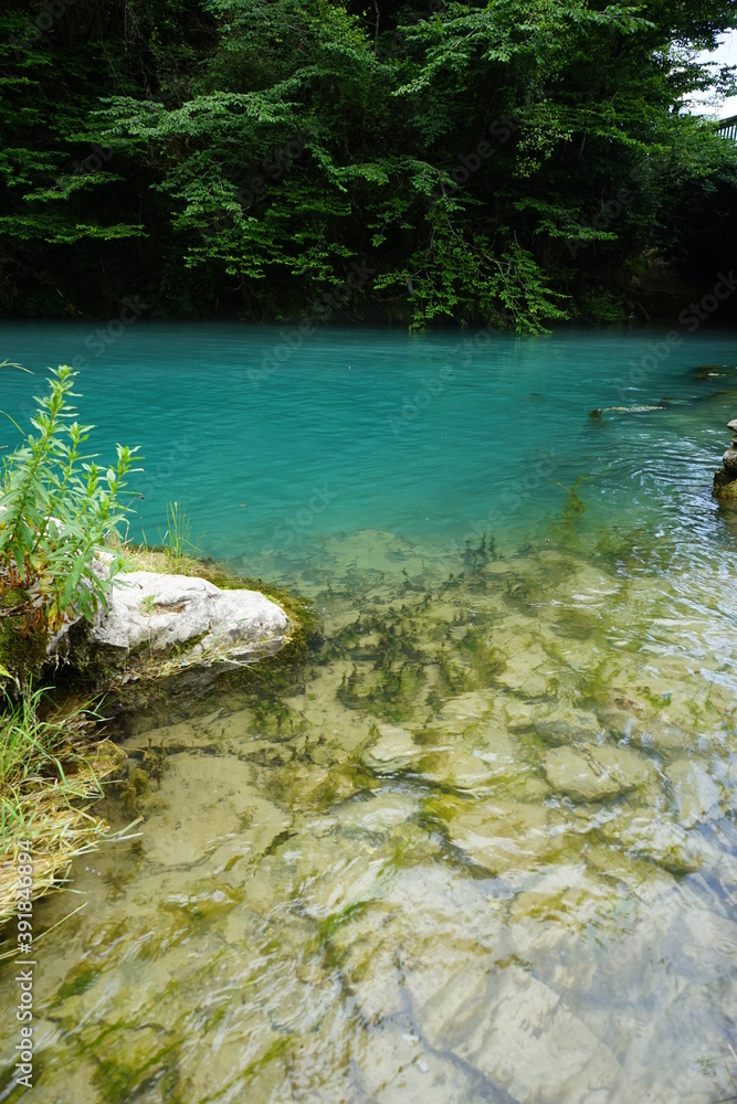 lake with beautiful turquoise water and stones