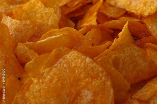 Potato chips or crisps . Close-up of potato chips or crisps. Food background.