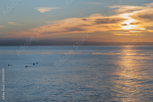 surfers at sunrise © chrissie