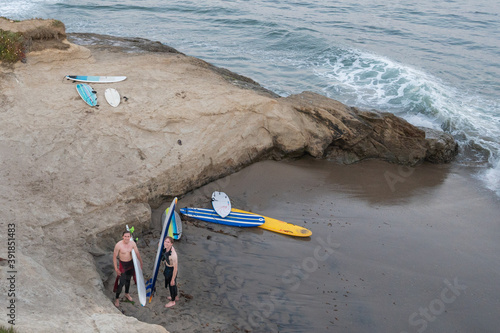 surfers on beach