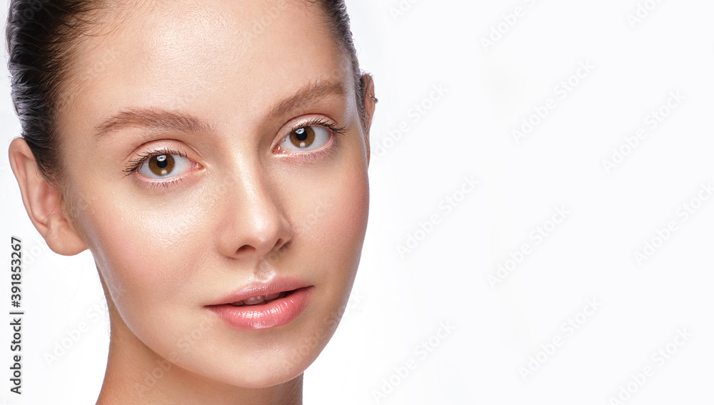 Beautiful young girl with a light natural make-up and perfect skin. Beauty face. Beautiful young girl with a light natural make-up and perfect skin. Beauty face.
