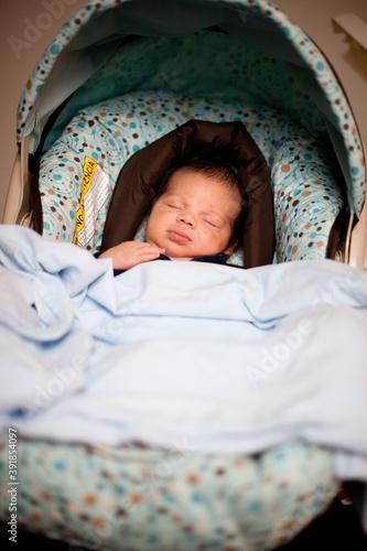 Obraz na płótnie Newborn Baby Sleeping Peacefully in Car Seat