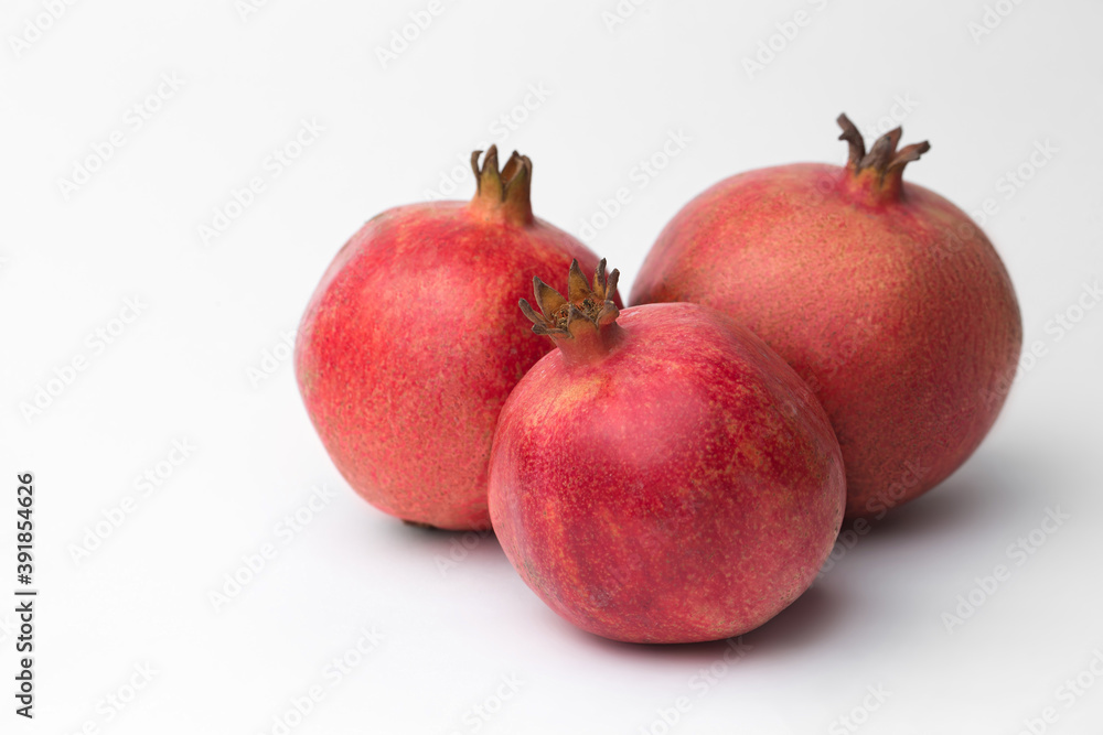 Whole pomegranate in studio on white background Whole pomegranate in studio on white background