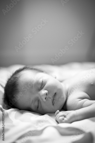 Newborn Baby Sleeping Peacefully at Home, Black and White Portrait