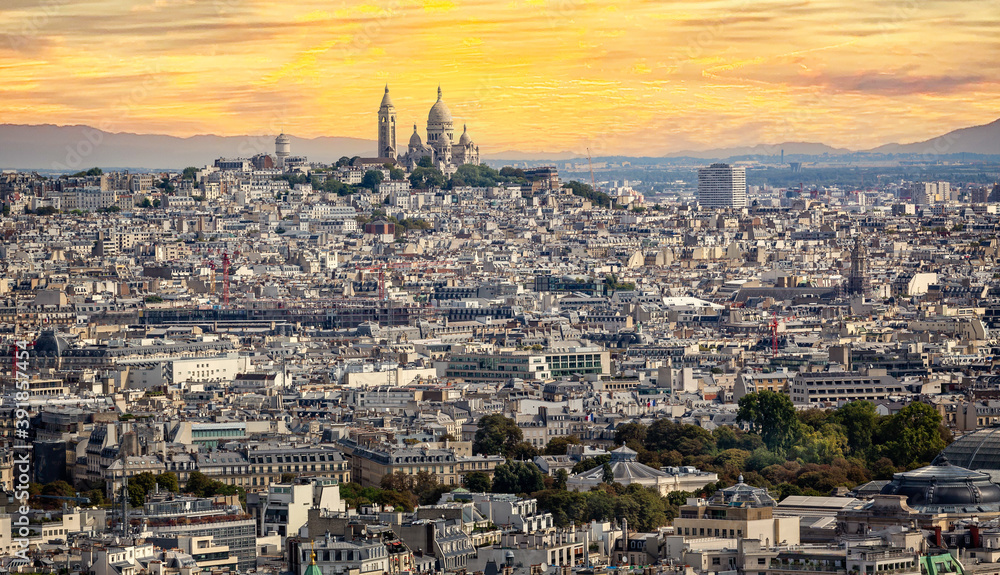 Basilica of the Sacred Heart on the summit of Montmartre seen from the Eifel Tower at sunset in Paris, France on 26 August 2018