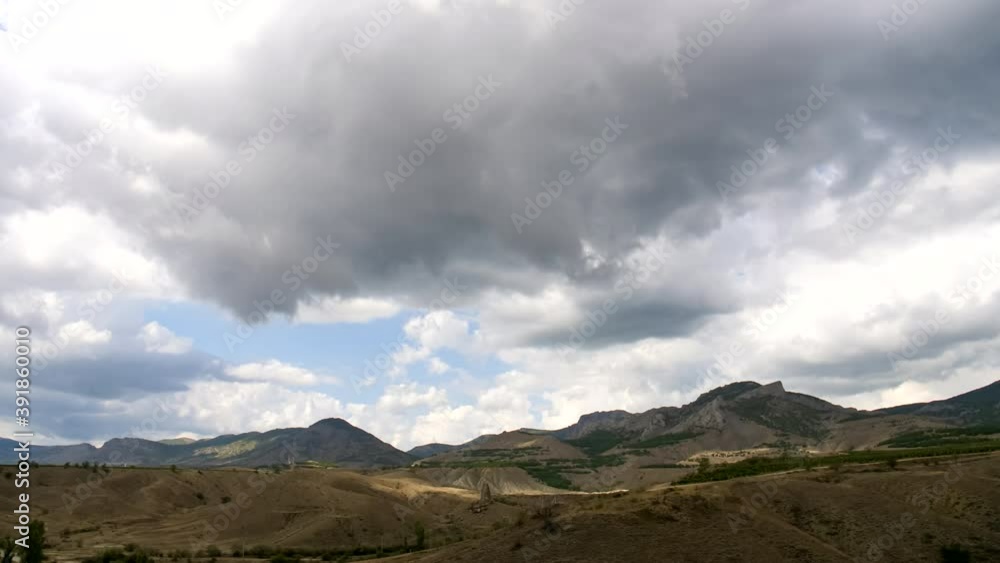 Mountain landscape. Clouds float across the blue sky. Mountain landscape. Clouds float across the blue sky.