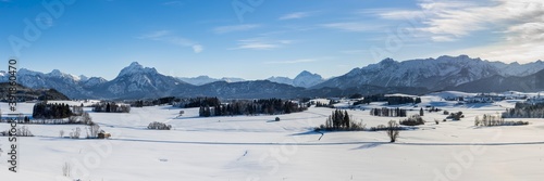 panoramic landscape at winter with alps mountains in Bavaria © Wolfilser