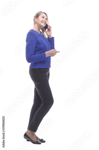 side view. woman housewife talking on her smartphone.