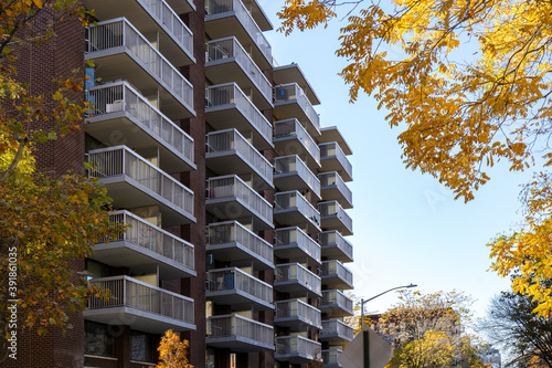Slika na platnu Apartment brick building with balconies for each unit
