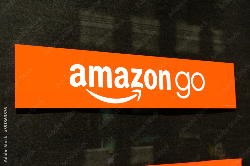 Amazon Go sign on store window. Amazon Go is a chain of cashless