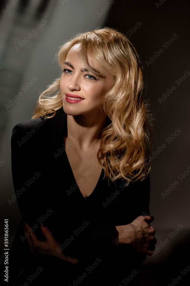 Fashion portrait of beautiful woman with curly blonde hair Fashion portrait of beautiful woman with curly blonde hair