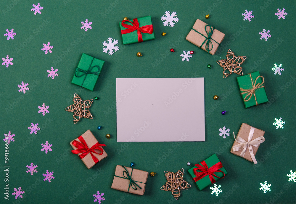 Postcard in the middle of a frame made of gifts on a green background.