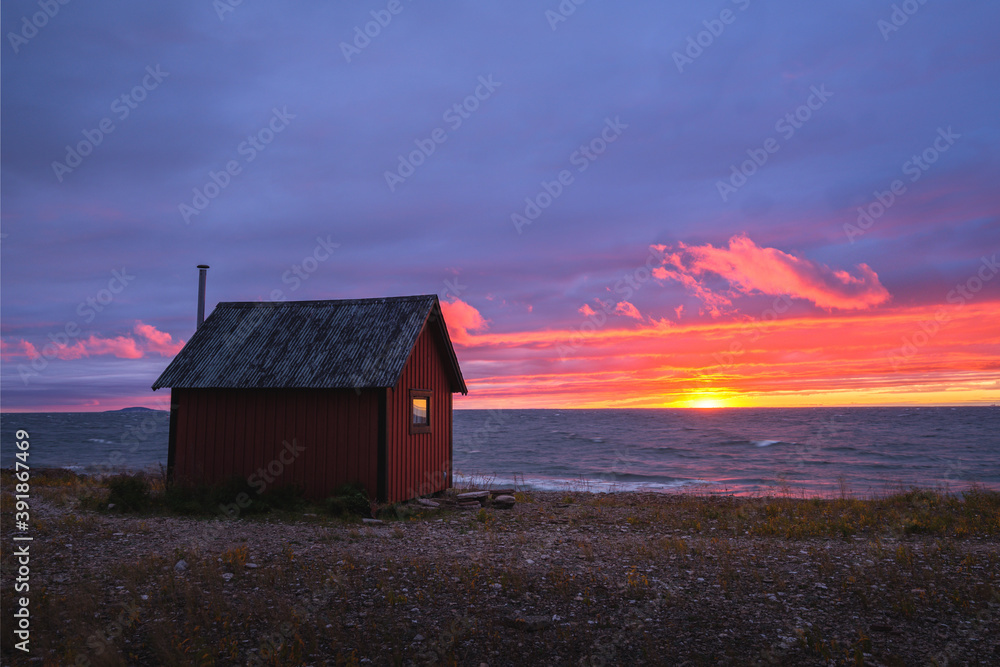 Little hut during sunset at the coastline of island of Öland, Sweden