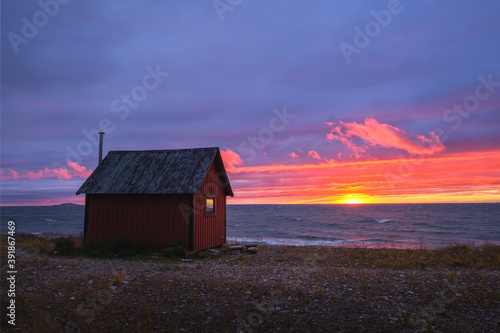Little hut during sunset at the coastline of island of Öland, Sweden