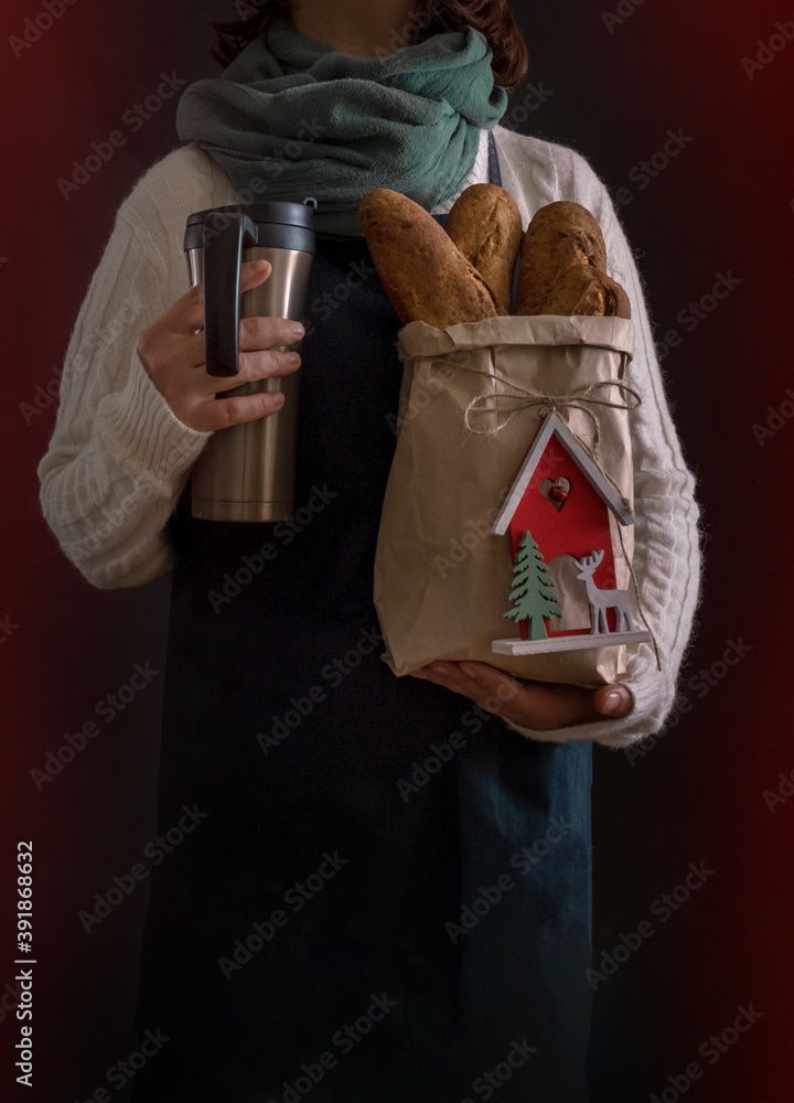 bread hand holding white new year christmas shopping bag delivery coffee to go