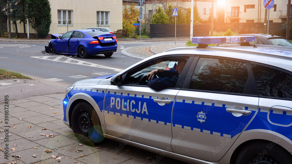 Police car and an accident on the road. Police flashing blue lights at accident damaged car. Police car and an accident on the road. Police flashing blue lights at accident damaged car.