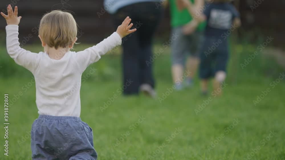 Baby child walk to catch brothers and mother in nature, funny toddler run Baby child walk to catch brothers and mother in nature, funny toddler run