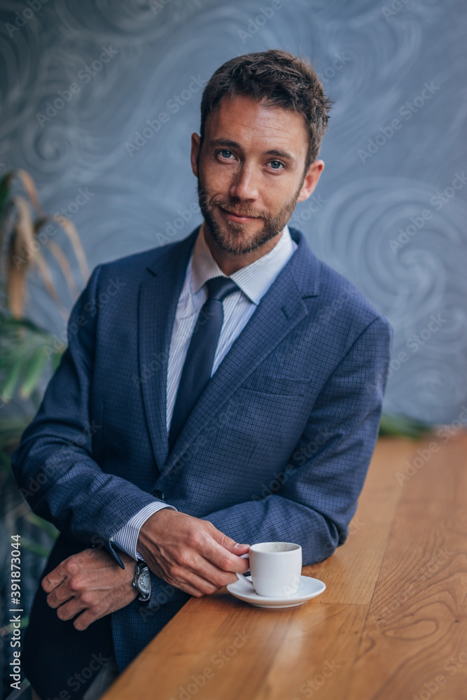 handsome businessman drinking coffee handsome businessman drinking coffee