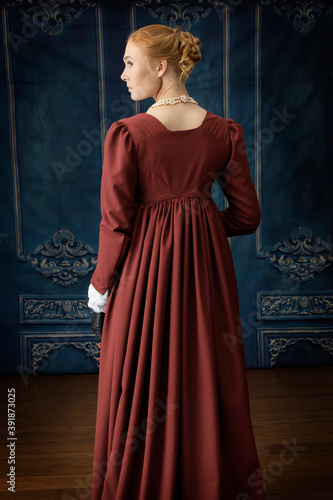 A regency woman wearing a white muslin dress  © Kathy