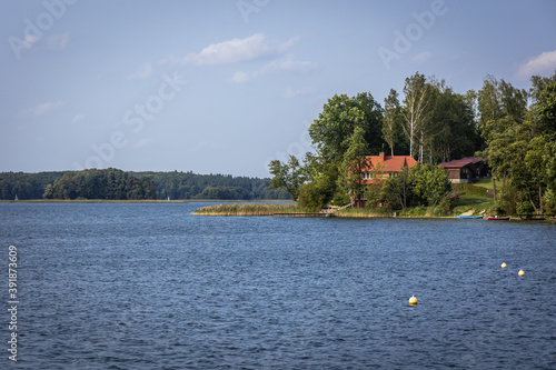 Fototapeta Naklejka Na Ścianę i Meble -  Shore of the Narie lake of Ilawa Lake District in Kretowiny, small village in Warmia Mazury region of Poland