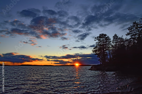 Dramatic northern sunset. Lake Keret, North Karelia, Russia photo