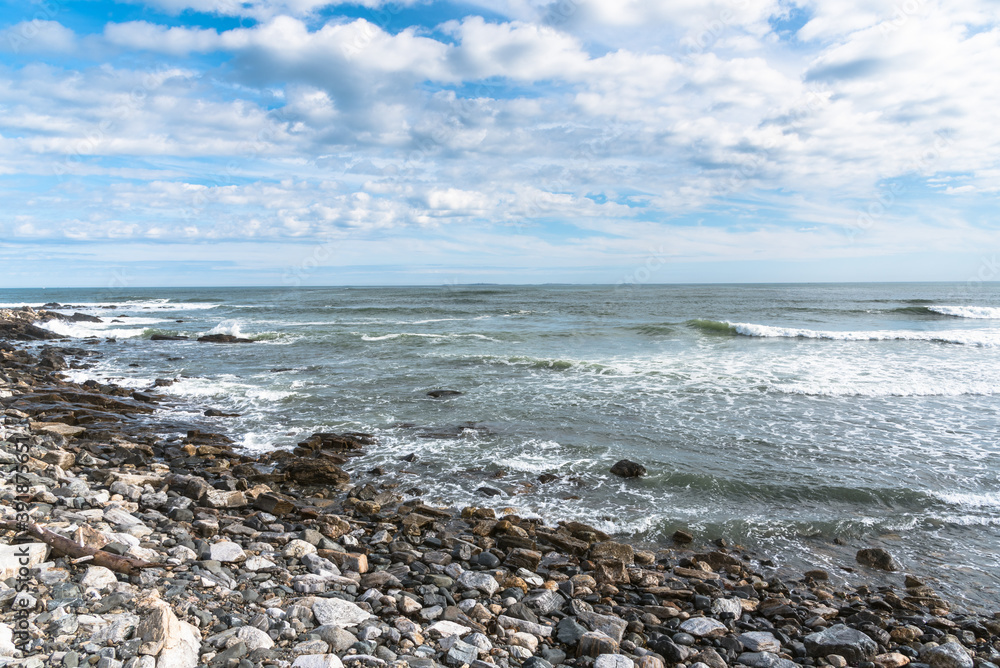 Roky shore along the coast of New Hampshire on a partly cloudy autumn day Roky shore along the coast of New Hampshire on a partly cloudy autumn day