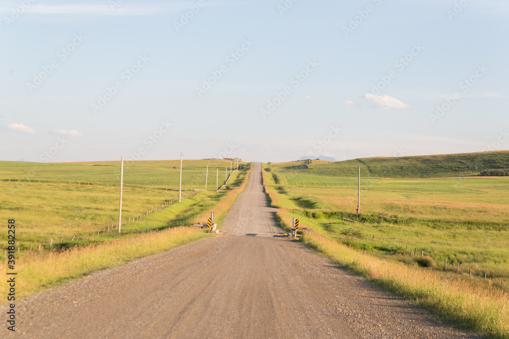 country road with rolling hills