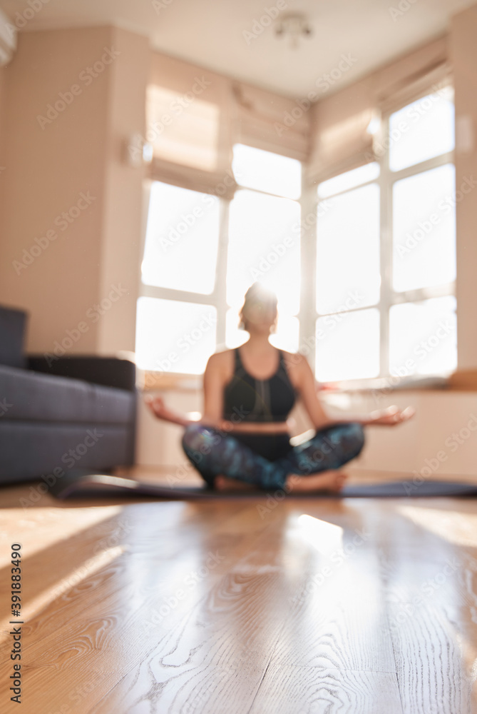 Woman meditating and sitting on lotus pose Woman meditating and sitting on lotus pose