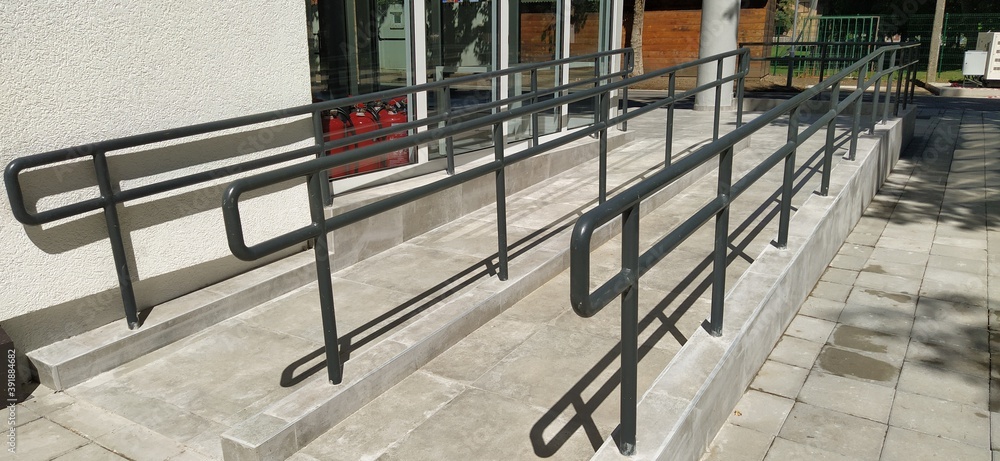 Discluding Ramps Disabled ramps next to the building's entrance. New school equipped ...