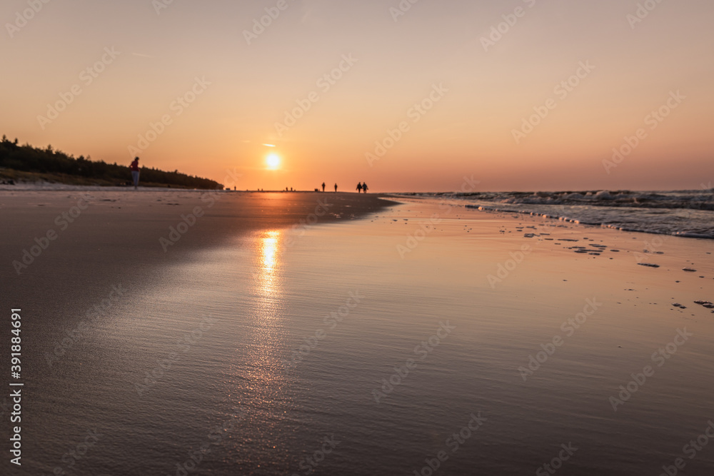 Beach in Debki resort village during sunset on the Baltic Sea coast in Pomerania region of Poland