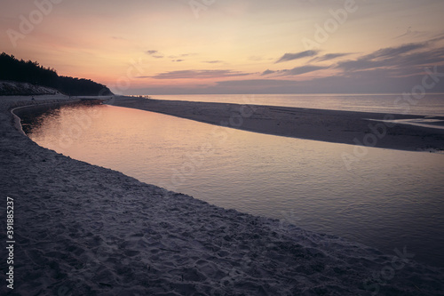 Mouth of River Piasnica and Baltic sea in Debki resort village in Pomerania region of Poland