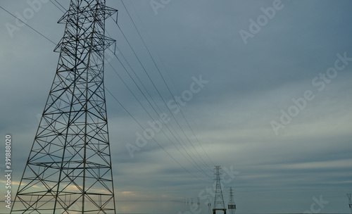 High voltage power lines over Lake Pontchartrain near New Orleans on an overcast evening.