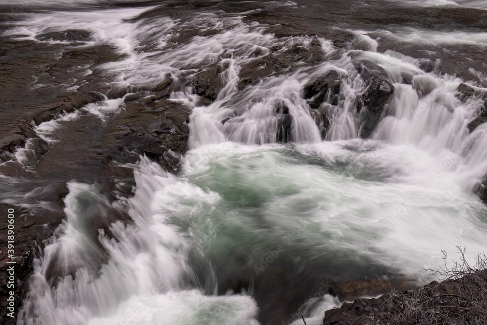 Close-up of Small Waterfalls in River