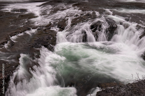 Close-up of Small Waterfalls in River