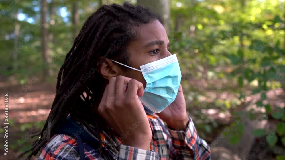 Healthy Young Black Man Takes Off Face Mask and Breathes Deep Healthy Young Black Man Takes Off Face Mask and Breathes Deep
