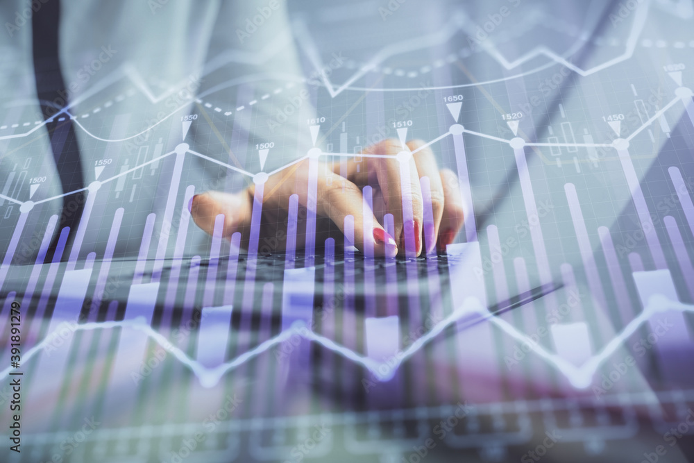 Double exposure of businesswoman hands typing on computer and financial graph hologram drawing. Stock market analysis concept. Double exposure of businesswoman hands typing on computer and financial graph hologram drawing. Stock market analysis concept.