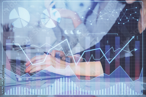 Multi exposure of woman hands typing on computer and financial graph hologram drawing. Stock market analysis concept.